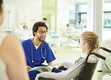 PCC doctor talking to child patient in hospital